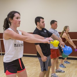 Student doing kettle ball exercises at the Ϲٷַ Plex
